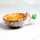 Scented candle in a coconut shell - Hibiscus - orange-yellow